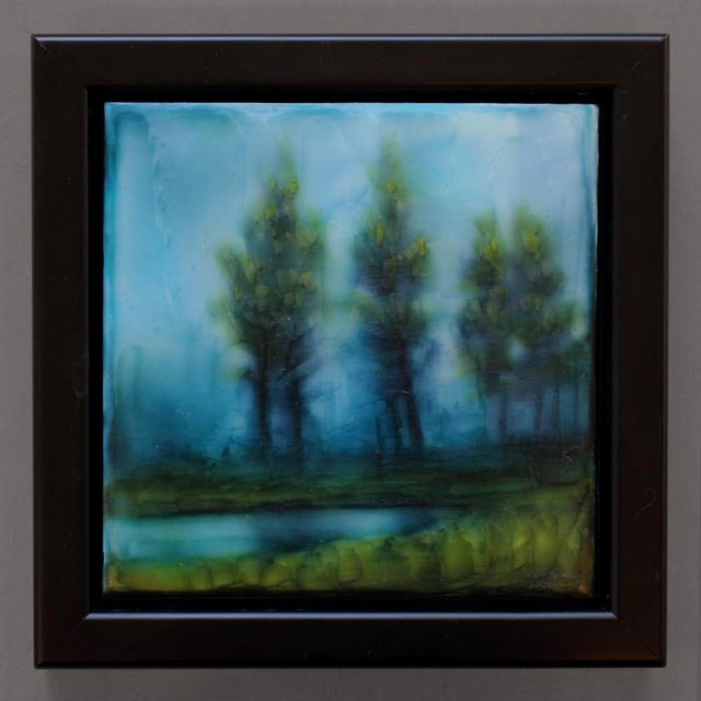 This acrylic piece presents a serene landscape, featuring softly blurred silhouettes of trees against a tranquil body of...