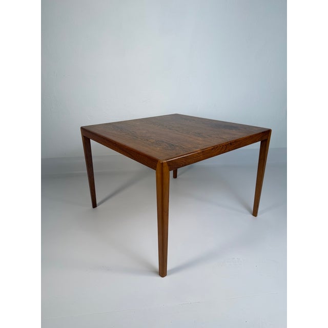 Original danish rosewood coffee table designed by johannes andersen (1903–1991) and manufactured by the renowned danish...