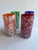 Set of four colorful handblown confetti glasses, one orange, one red, one blue and one green. Combined shipping available.