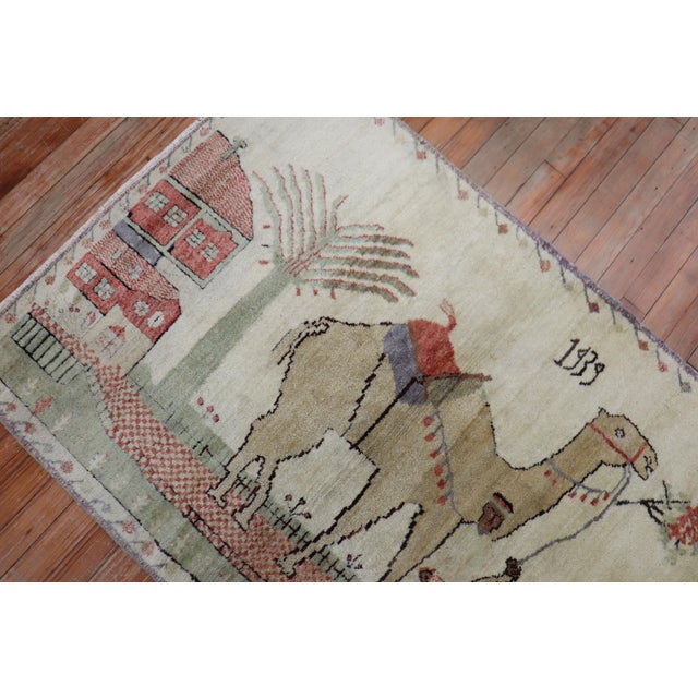 Scatter size Turkish Kula Rug dated 1939 with a camel and donkey on an ivory field. The quality on this piece is superb...