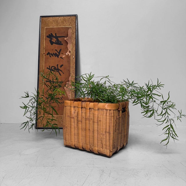 Highly decorative vintage Japanese bamboo basket, dating from the 1950s, handwoven in a sturdy rectangular form....