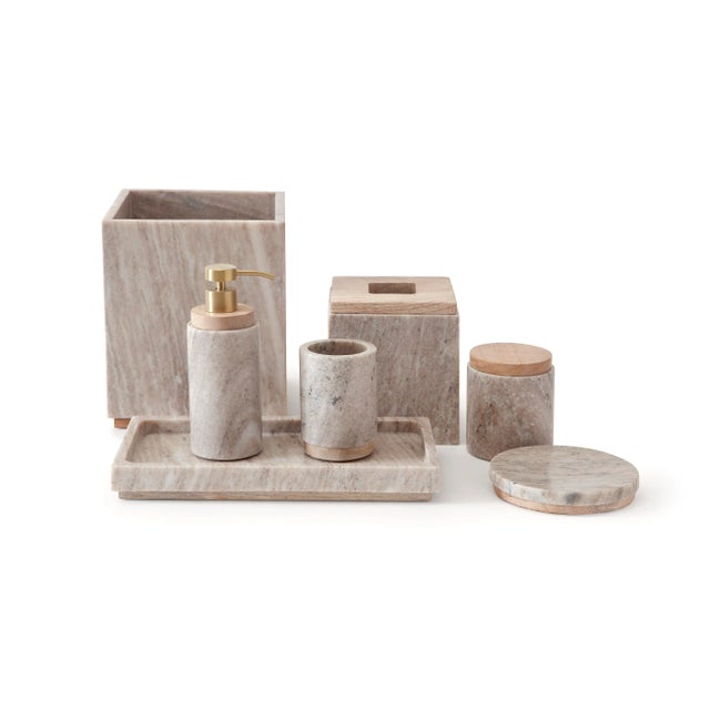 Crafted from natural marble and featuring mango wood accents, this beige-toned collection adds a modern-meets-earthly...