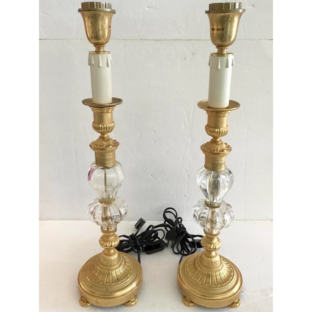 Fabulous pair of Jansen Style table lamps with Gilt Bronze details and Clear glass elements. Amazing Bronze details with...