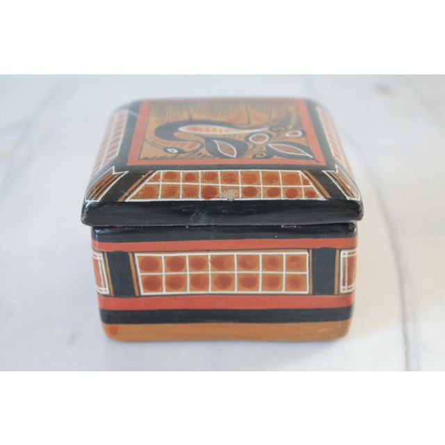 Vintage traditional folk art Mexican Tonalá pottery trinket box. Hand-painted representation of a stylized wading bird or...