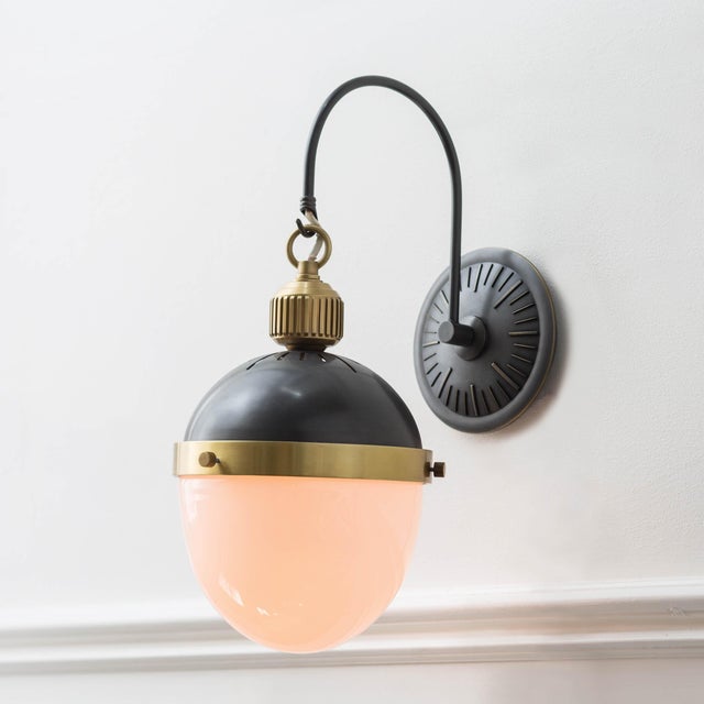 Styled in a classic hanging formation with multiple finishes to choose from, this sconce merges 20th century design with...