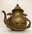 An engraved brass teapot or hot water kettle has the most beautiful patina. The handle has scroll work on this 19th...
