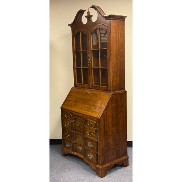 Beautiful Pennsylvania House secretary desk featuring a warm, richly grained wood finish and classic traditional styling....