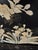 Stunning, three-dimensional mother-of-pearl, hand carved Pandas inlaid on black ebony lacquer panels with brass feet. A...
