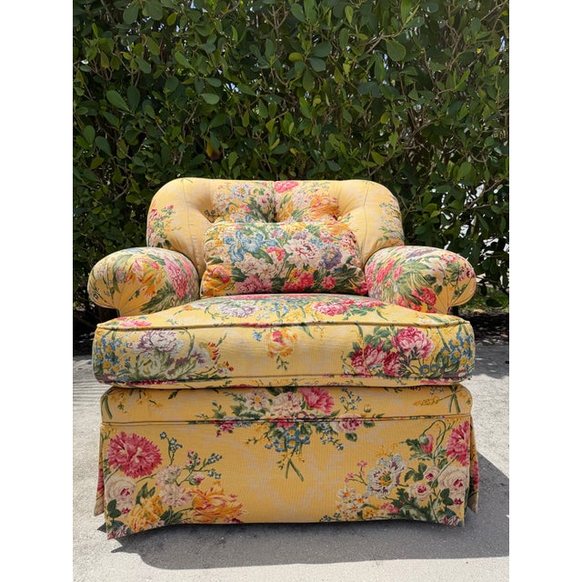 Vintage Sherrill upholstered swivel lounge chair featuring a vibrant floral upholstery in yellow, pink, blue, and green...