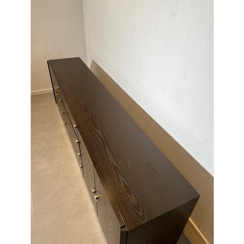 Impressive extra-long modernist sideboard executed in dark stained oak veneer with a beautiful pronounced grain pattern....