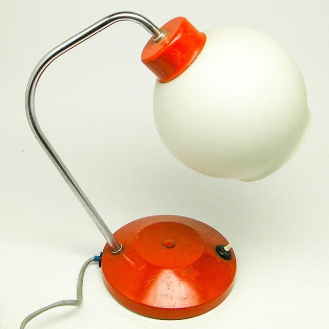 The table lamp was produced in Czechoslovakia by the Lidokov company in the 70s. It is made in the style of Mid-cent. It...