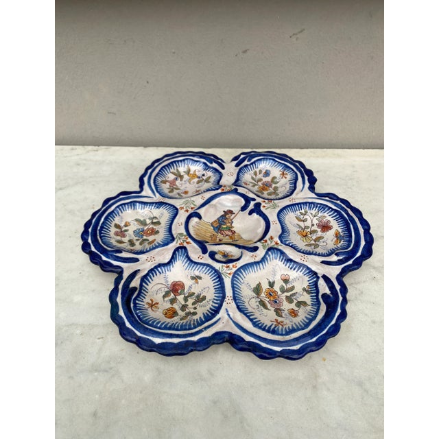 Antique rare large French faience oyster plate, circa 1890 made by the manufacture of Malicorne with a Breton man on the...