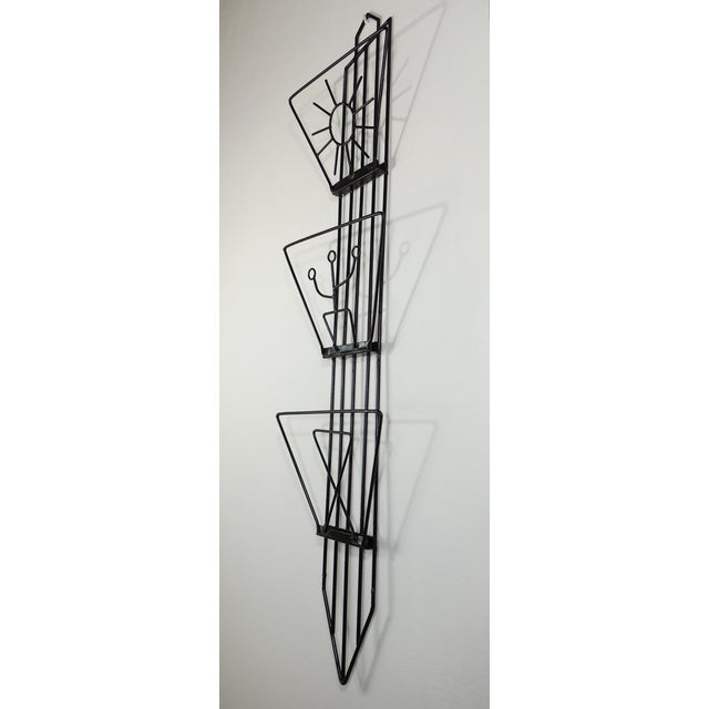 Black Wall Magazine Rack, 1950.