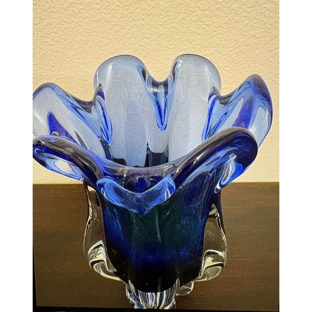 The blue is so vivid and there is a small hint of green in the bottom of this vase. It is indeed a heavy piece of hand art...