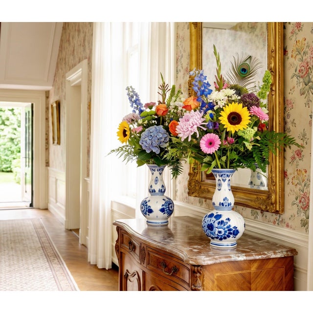 An elegant pair of antique Dutch Delft Blue knobbel vases (Bulbous bottle vases) believed to date from the early 20th...