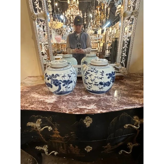 Pair of Vintage Chinese export porcelain blue and white covered jars. Circa 1920. A timeless and classic touch for a fine...