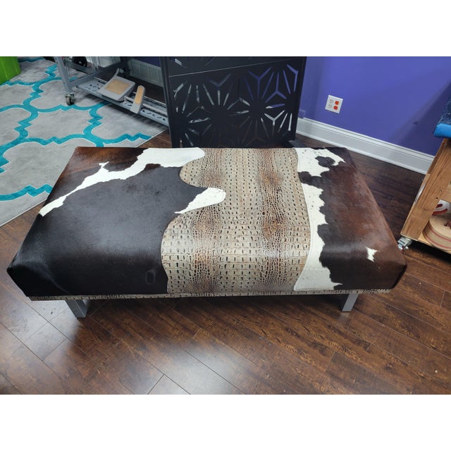 this statement ottoman has been completely transformed using a Brazilian alligator hide paired with a cow hair on hide,...