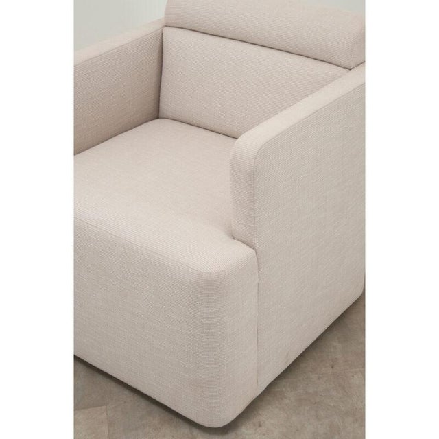 Dimensions: 29 ¼” H x 28” W x 29 ¼” D A comfortable custom swivel armchair recently made by Dmitriy & Co. The neutral...