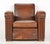 Vintage tank style Art Deco dark brown leather studded club chairs made in France. It has a square backrest, thick rolled...