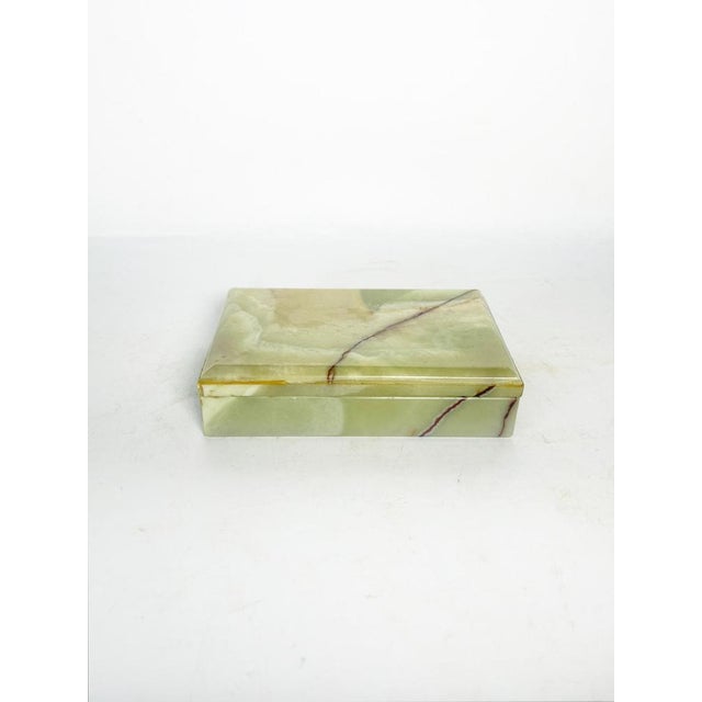 Rectangular box in yellow-green onyx, made in France around 1970. This piece showcases the natural beauty of the stone,...