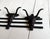 Vintage western rockabilly painted black and red iron long horn bull coat or hat rack. Meant for the wall. In excellent...
