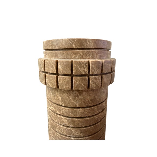 Handcrafted from richly toned brown marble, the Array Tall Vase is defined by its elongated silhouette and rhythmic carved...