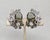 1960s rhodium plated prong set oval unfoiled open backed faux-black diamond with a "flower" at the bottom comprised of a...