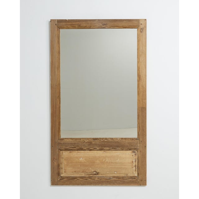 A 19th century French trumeau mirror, constructed in wood with a vertically structured composition. The piece...