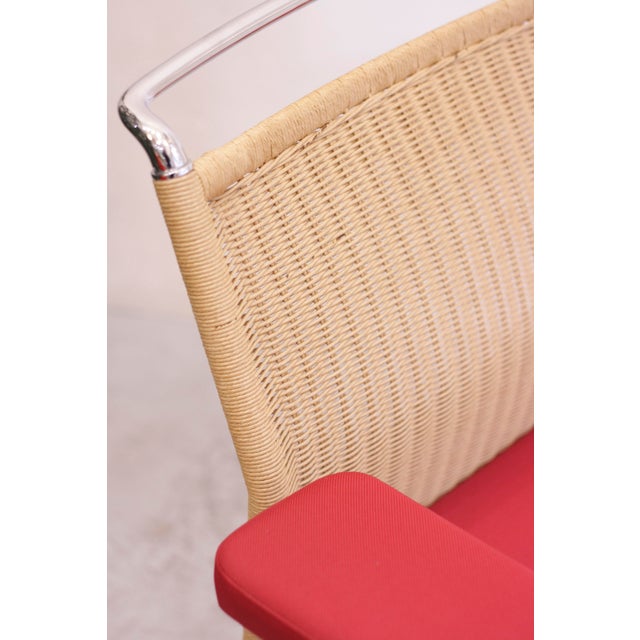 AC 2 office chair by Antonio Citterio for Vitra. Frame in chrome with five casters, upholstered seat in red TESSO fabric...
