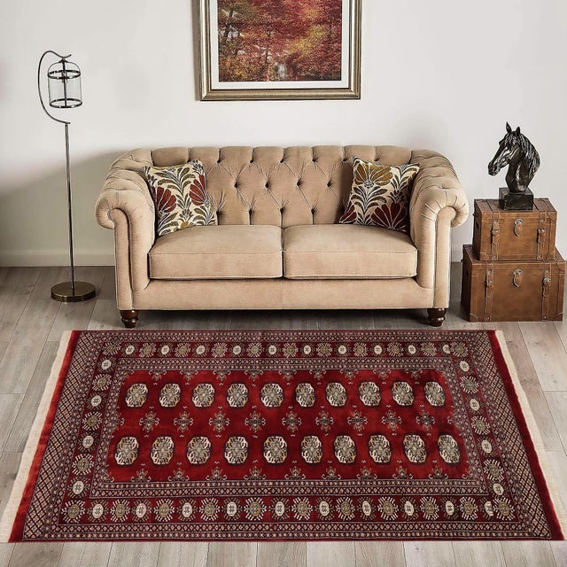 Transform the interior of your home with a beautiful hand-knotted Bokhara rug. Meticulously crafted with intricate...