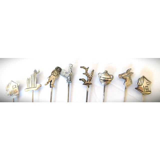 Antique sterling silver vintage set of eight figural appetizer forks. Each fork measures 3.25 inches tall x .50 inches...