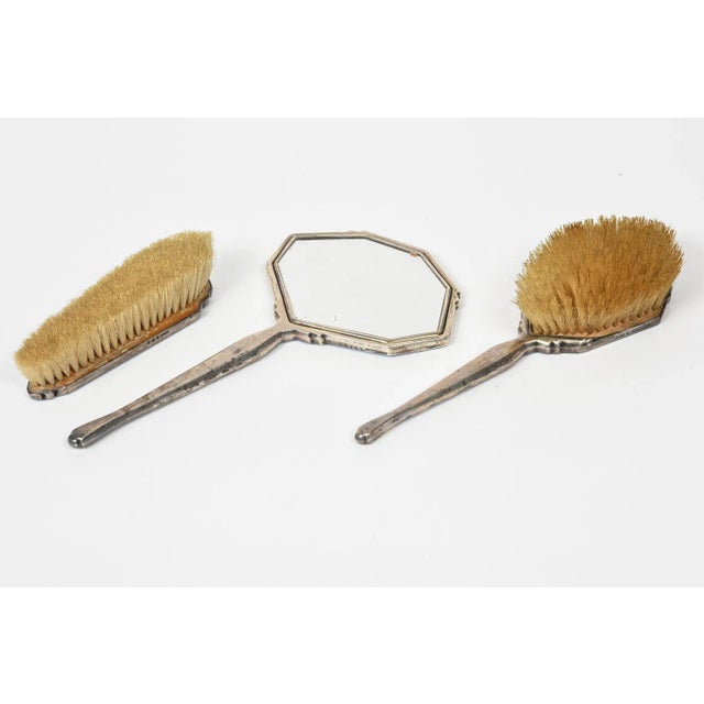 Beautiful blue guilloche enamel and sterling silver three piece brush set featuring a mirror and 2 brushes. This set was...