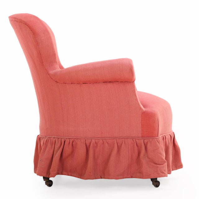 Elegant pair of French Napoleon III–period armchairs dating to circa 1860. Each chair features a rounded back with...