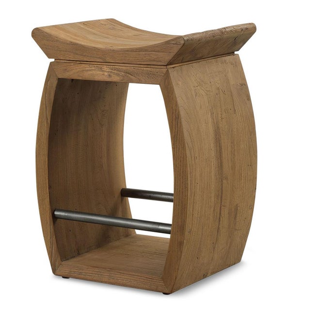 Crafted from solid reclaimed elm, this counter stool combines rustic character with a clean, sculptural silhouette. The...