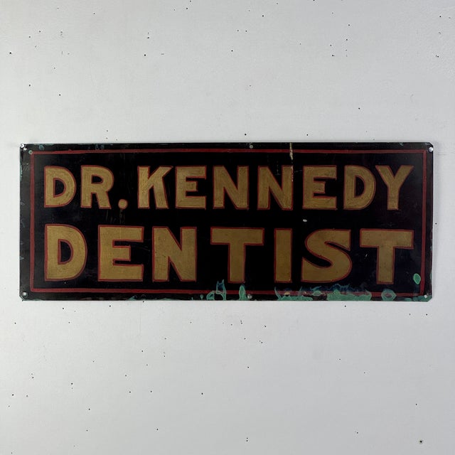 A double sided vintage metal sign. This was originally a sign advertising a dentist and at some point Florence used one...