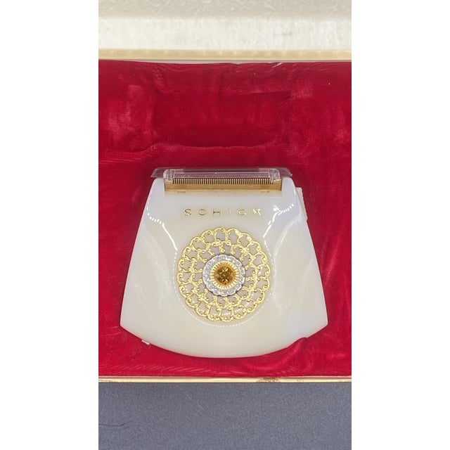 Elegant vintage Lady Schick Crown Jewel electric shaver in its original presentation box. This beautiful mid-century...