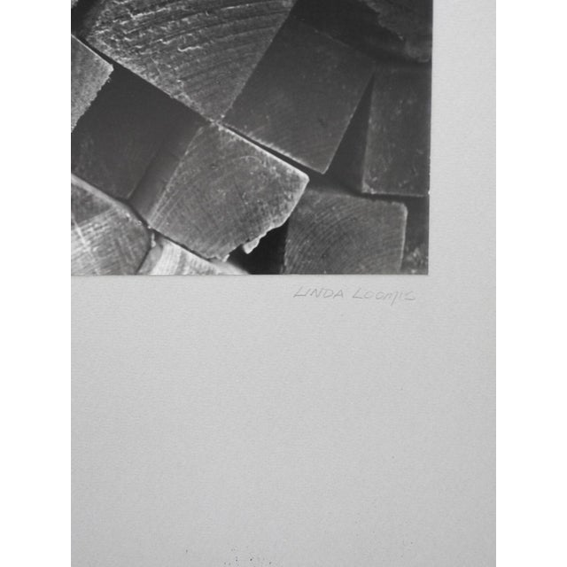 Vintage abstract stacked lumber black and white photograph. Signed Linda Loomis in pencil on backing. Unframed, displayed...
