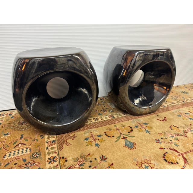 Design Plus Gallery presents a Pair of Metallic Charcoal Duffy Stools from Made Goods. The name Duffy says it all, it's...