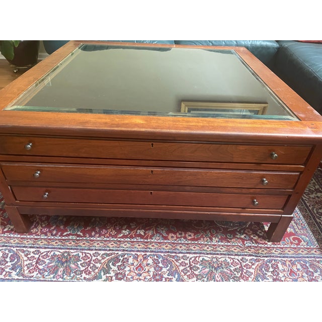 Solid Cherry and original glass square 40x40x19 coffee table. Three drawers, top lined with black felt. Original info...