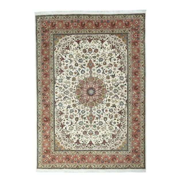 This high-quality, hand-knotted Tabriz 50 Raj oriental rug impresses with its fine knotting, luxurious silk content, and...