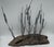 This Curtis Jere-style sculpture captures the beauty of nature through driftwood and delicate, detailed copper cattails....