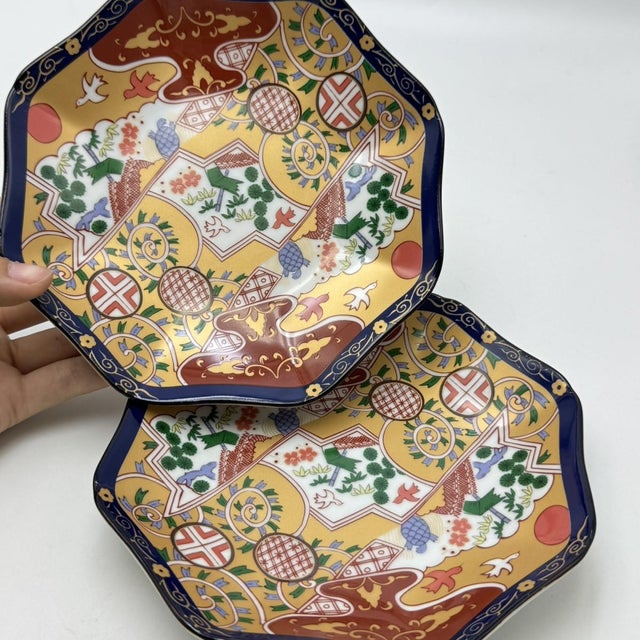 A set of five octagonal porcelain plates crafted by Hayashi Kurō (Japan). Featuring an octagonal shape with a scalloped...