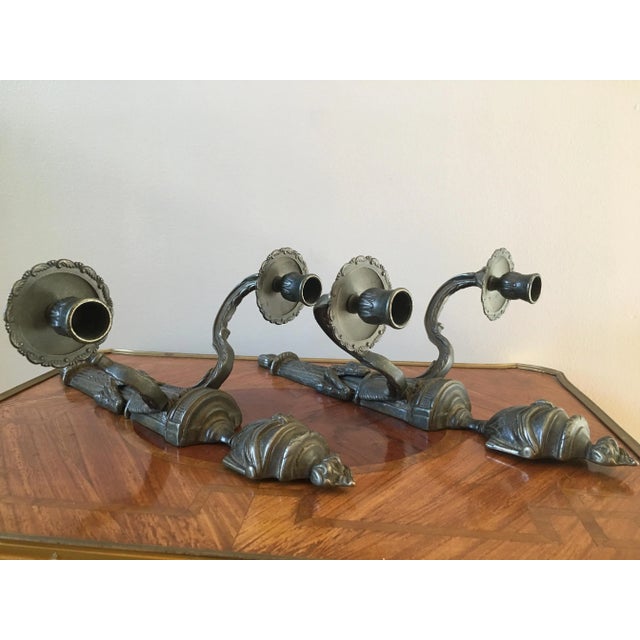 A beautiful pair of heavy Italian sconces with urns, swags, and flame details. Measurements are for each.