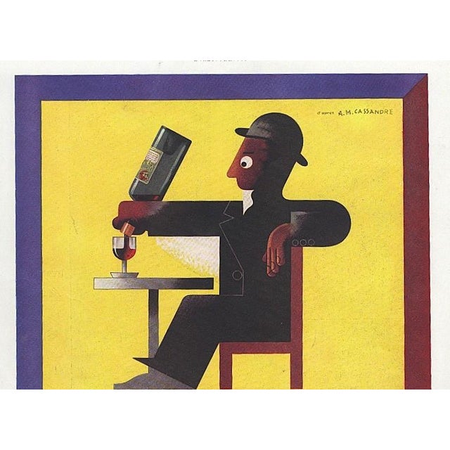 This vintage French advertisement print is for Dubonnet, a well-known liqueur aperetif. It is an iconic image which was...