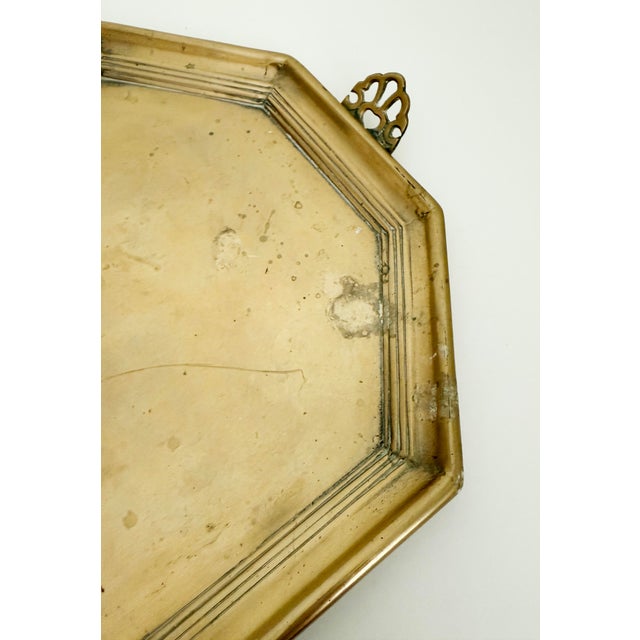 Stunning heavy brass tray with chamfered corners, ribbed detail around rim, and ornate acanthus leaf handles. Unmarked.