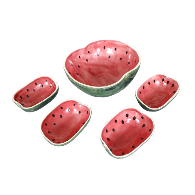 A 1989 hand crafted majolica serving bowl and four side bowls in the shape of a watermelon, by ceramicist Jan Pugh. Made...