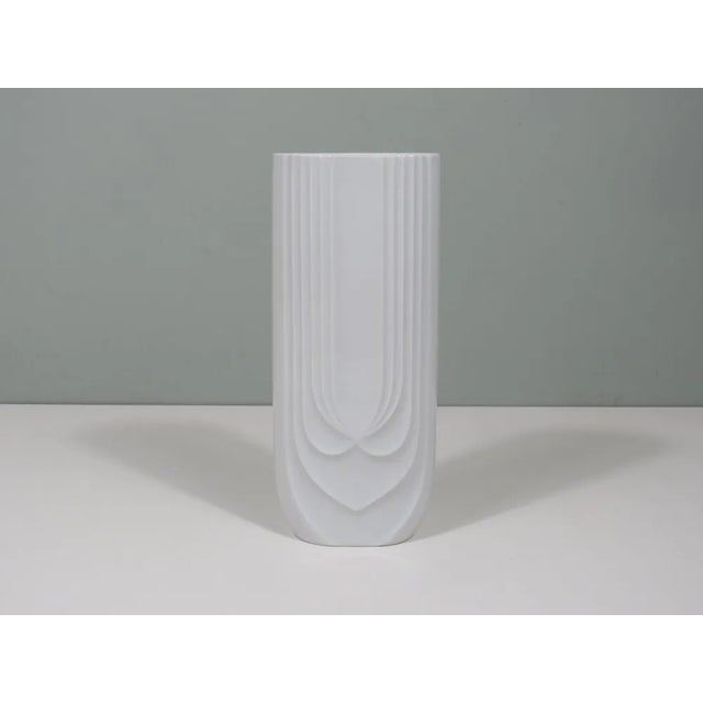 This Hutschenreuther porcelain vase combines craftsmanship with modern design. The glossy glazed surface and graceful...