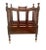 Early 20th century mahogany English Canterbury magazine rack on brass casters. Features four curved partitions and a...