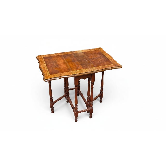 Add a touch of classic elegance to your space with this William and Mary–style drop-leaf table, beautifully detailed with...