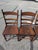 This is a beautiful matching set of four mission style chairs made from what appears to be oak wood. They are a of a rich...